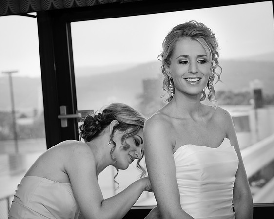Bride with Bridesmaid Getting Ready
