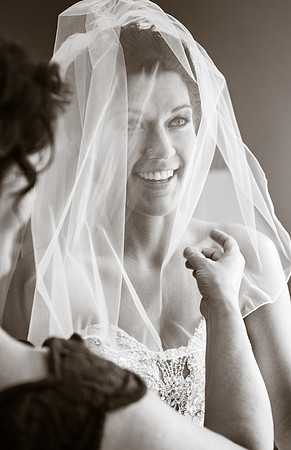 Happy Bride with Wedding Veil Covering Face