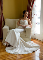 Bride sitting by French Doors