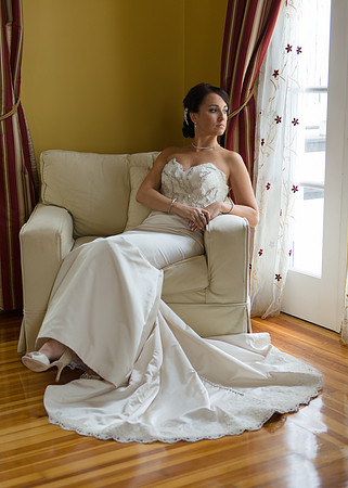 Bride sitting by French Doors