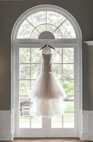 Wedding Gown Hanging on Window