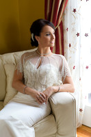 Bride Sitting in Chair by Window