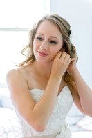 Bride putting on Jewelry