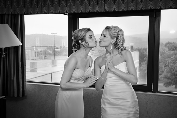 Bride with Bridesmaid Getting Ready