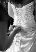 Bride laced into Gown