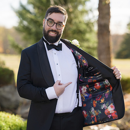 Groom showing off jacket