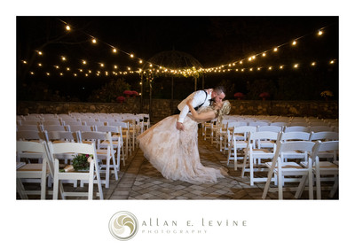 Bride & Groom dipping with string lights